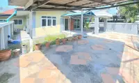4 Bedroom House for Sale in Bang Sare covered patio with terracotta pots and tiled outdoor flooring