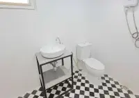4 Bedroom House for Sale in Bang Sare bathroom with vessel sink, toilet, and checkered tile floor