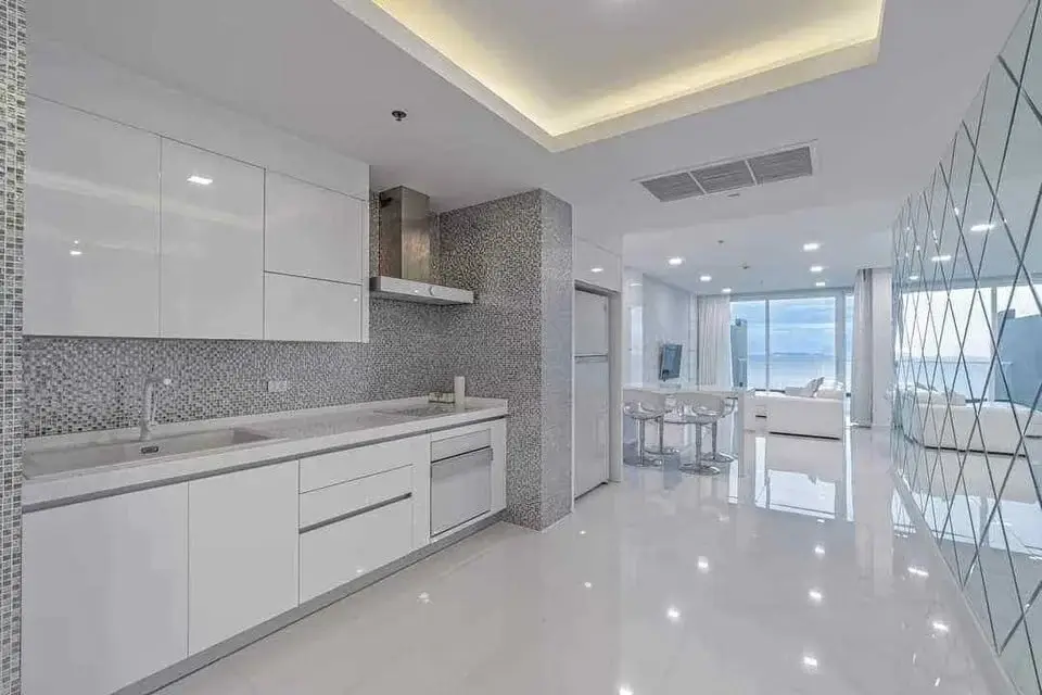 3 Bedroom Condo for Sale at Bay View Resort modern white kitchen with mosaic tile backsplash and ocean view
