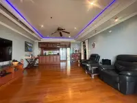 2 Bedroom Condo for Sale at Bay View Resort open-plan living room with wood flooring and blue accent lighting
