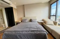 1 Bedroom Condo for Rent at Once Pattaya master bedroom with double bed air conditioning and city view window