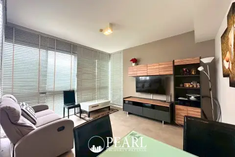 2 Bedroom Condo for Sale in Pratumnak Hill master bedroom with king-size bed and sea view