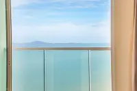 2 Bedroom Condo for Sale at Cetus Beachfront glass balcony with panoramic turquoise sea and island views in Pattaya