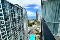 1 Bedroom Condo for Sale at The Twin Tower Jomtien Beach Pattaya balcony view with rooftop pool and Jomtien Beach sea view