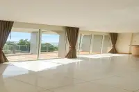 3 Bedroom Condo for Sale at Whale Marina spacious unfurnished living area with glossy tiles and wide balcony sea views
