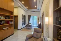 3 Bedroom House for Sale at Amarin House 2 interior hallway with wooden bookshelves, dining area, and sliding glass door