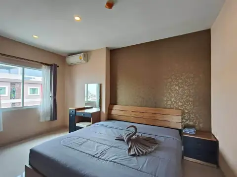 2 Bedroom Condo for Rent at CC Condominium 2 bedroom with floral accent wall, air conditioning unit and city view