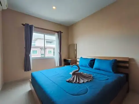 2 Bedroom Condo for Rent at CC Condominium 2 bedroom with blue bedspread, curtains and balcony view window
