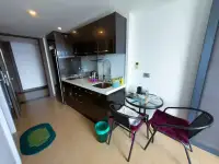 Studio Condo for Sale at Centara Avenue Residence and Suites compact kitchenette with dining table and chairs