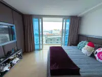 Studio Condo for Sale at Centara Avenue Residence and Suites bedroom with balcony and city view