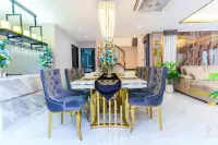 4 Bedroom House for Sale in Central Pattaya formal dining area with marble table, velvet blue chairs and gold accents