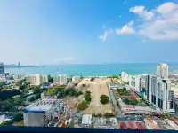 1 Bedroom Condo for Rent at Centric Sea high-rise view of Pattaya coastline, beach, and ongoing construction site