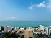 1 Bedroom Condo for Rent at Centric Sea panoramic ocean view with Pattaya beach, boats, and city buildings