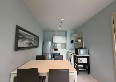 2 Bedroom Condo for Rent at Centric Sea dining area with kitchenette, refrigerator, and washing machine