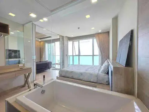 1 Bedroom Condo for Rent at Cetus Beachfront bathroom with soaking tub overlooking bedroom and sea view
