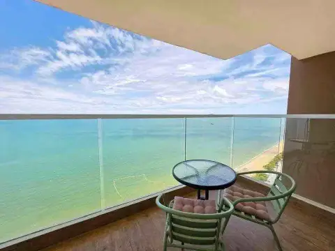 1 Bedroom Condo for Rent at Cetus Beachfront private balcony with seating overlooking turquoise sea and beach