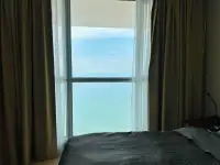 1 Bedroom Condo for Rent at Cetus Beachfront bedroom window with panoramic sea view