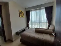 2 Bedroom Condo for Sale at Cetus Beachfront bedroom with city view and sheer curtains