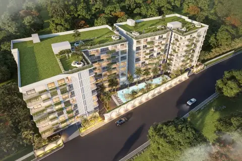 Avenue Boutique Pattaya: Aerial view of the condo complex with rooftop gardens, pool, and surrounding greenery.