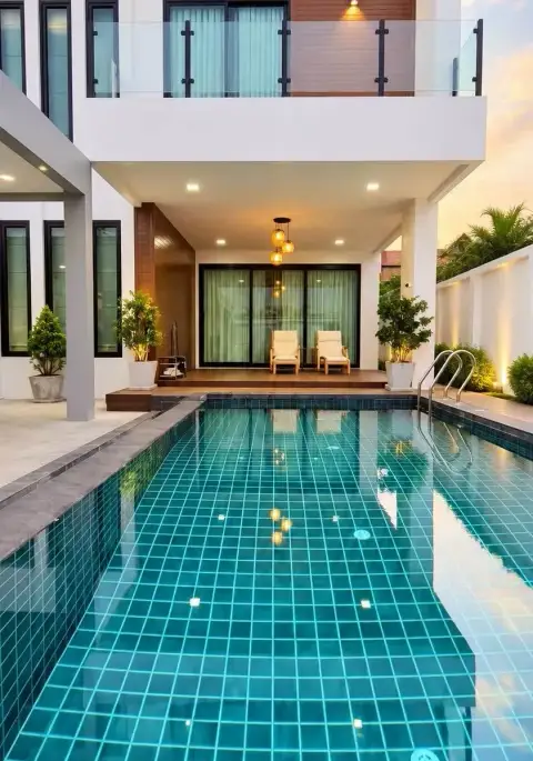 3 Bedroom House for Rent in Chak Nok backyard pool with poolside loungers and glass balcony above