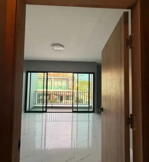 2 Bedroom Townhouse for Sale in Chak Nok doorway view into bright room with balcony sliding doors