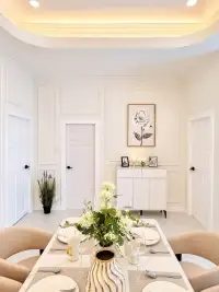3 Bedroom House for Sale at Chokchai Village 5 formal dining room with marble table and floral centerpiece