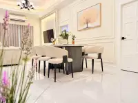 3 Bedroom House for Sale at Chokchai Village 5 dining space with upholstered chairs and framed tree painting