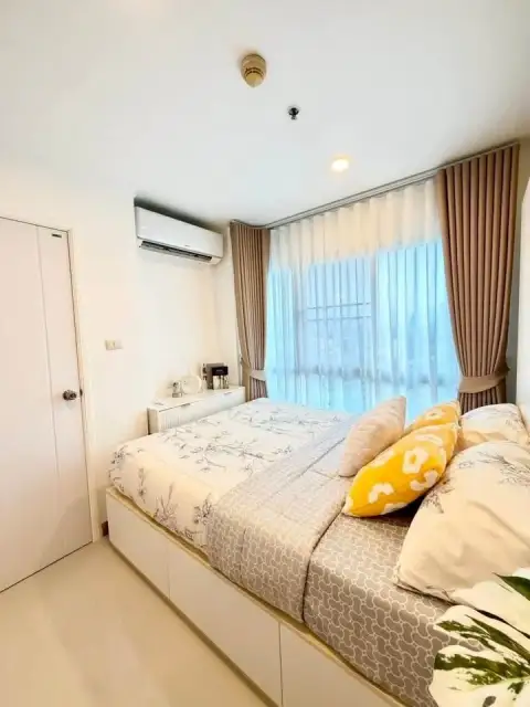1 Bedroom Condo for Sale at City Center Residence bedroom view toward entrance door and city window light