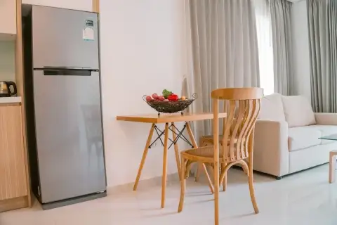 1 Bedroom Condo for Rent at City Garden Tropicana kitchen area with refrigerator and small dining table