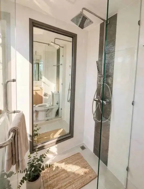 Studio Condo for Sale at City Garden Tropicana glass-enclosed shower with rain showerhead and mirror