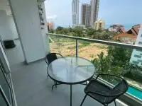 2 Bedroom Condo for Sale at Club Royal balcony with table and chairs overlooking pool and ocean view