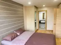 1 Bedroom Condo for Sale at Whale Marina bedroom with mirrored closet and en-suite bathroom entrance