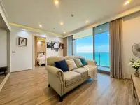 2 Bedroom Condo for Sale at Baan Plai Haad living room with sofa, wood flooring and ocean view