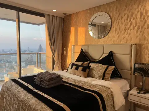 1 Bedroom Condo for Rent at Copacabana Beach Jomtien bedroom with balcony bathtub and ocean view