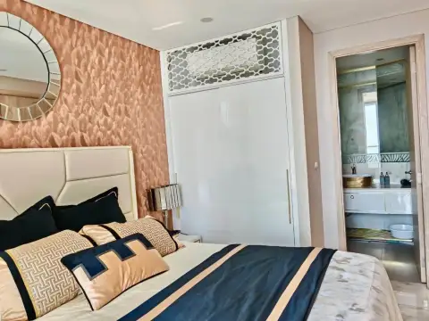 1 Bedroom Condo for Rent at Copacabana Beach Jomtien bedroom with built-in wardrobe and view into en-suite bathroom