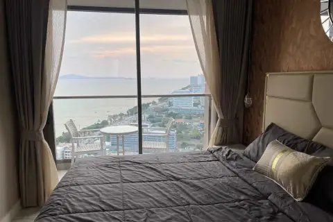 1 Bedroom Condo for Rent at Copacabana Beach Jomtien bed facing balcony with sunset sea view