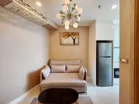 1 Bedroom Condo for Rent at Copacabana Beach Jomtien lounge area beside kitchen with stainless steel fridge
