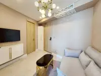 1 Bedroom Condo for Rent at Copacabana Beach Jomtien living space with entry door, TV console, and sofa