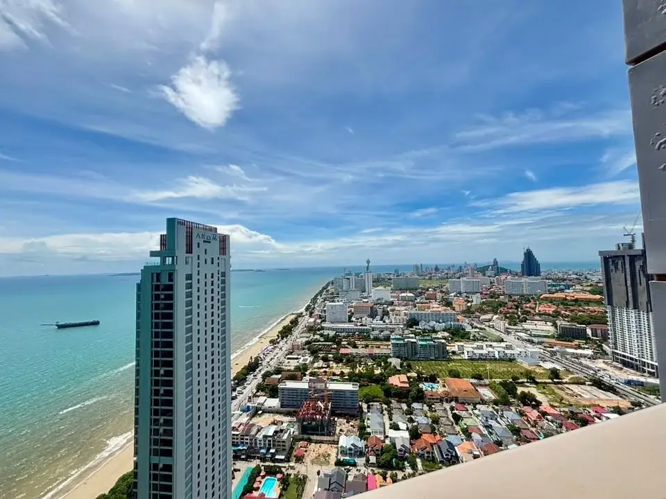 1 Bedroom Condo for Rent at Copacabana Beach Jomtien aerial view of coastline and high-rise towers