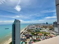 1 Bedroom Condo for Rent at Copacabana Beach Jomtien aerial view of coastline and high-rise towers