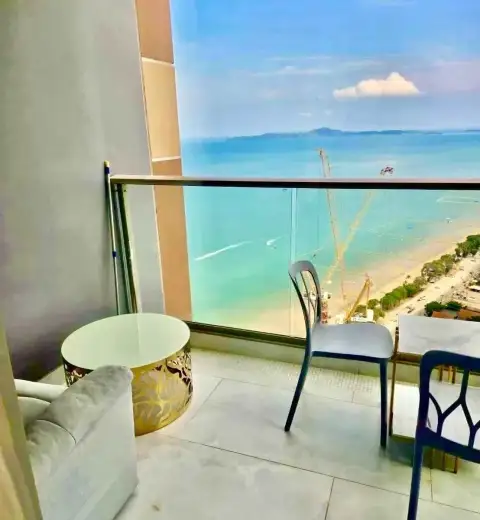 1 Bedroom Condo for Rent at Copacabana Beach Jomtien balcony seating area with panoramic sea and beach view