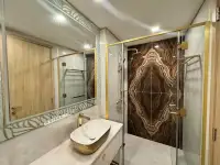 1 Bedroom Condo for Sale at Copacabana Beach Jomtien bathroom with marble shower and oval vessel sink