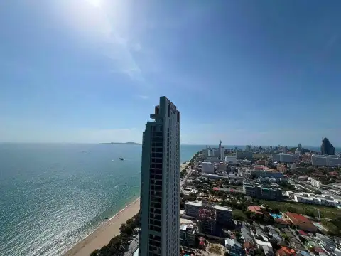2 Bedroom Condo for Sale at Copacabana Beach Jomtien high-rise tower with coastal cityscape and ocean backdrop
