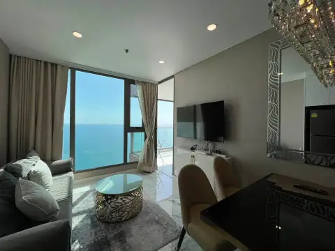 2 Bedroom Condo for Sale at Copacabana Beach Jomtien living room with sea-view windows and modern furnishings