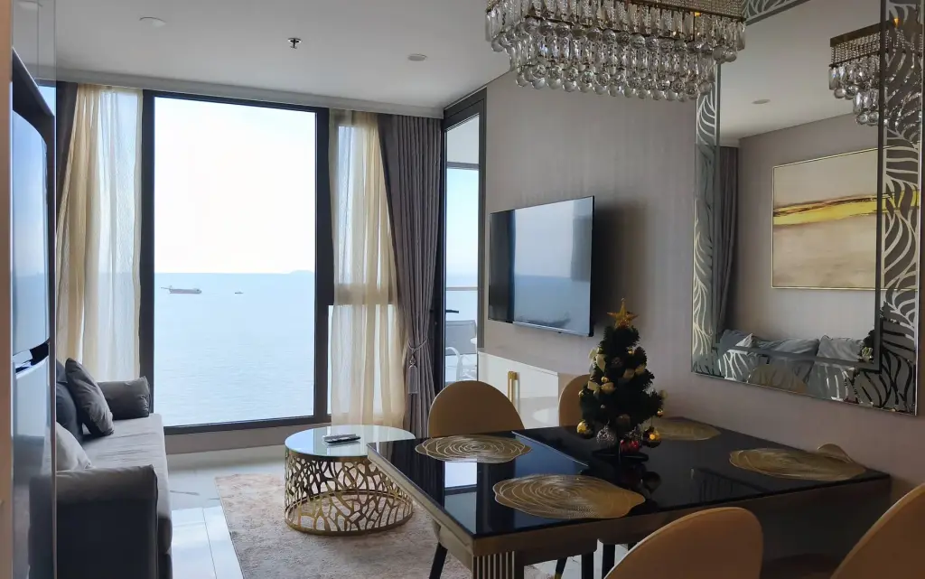 2 Bedroom Condo for Rent at Copacabana Beach Jomtien living and dining area with sea view and Christmas tree