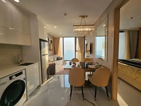 2 Bedroom Condo for Sale at Copacabana Beach Jomtien open-plan kitchen and dining area with ocean view window