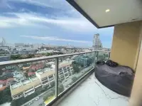 1 Bedroom Condo for Sale at Copacabana Beach Jomtien balcony with bean bag seating and panoramic city skyline view