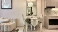 1 Bedroom Condo for Sale at Copacabana Coral Reef dining area with mirrored table and decorative wall mirror