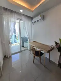 1 Bedroom Condo for Sale at Cosy Beach View study nook with wooden desk and balcony access