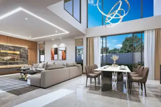 D Space Pattaya contemporary villa exterior with stone facade, large windows, and car park under blue sky.